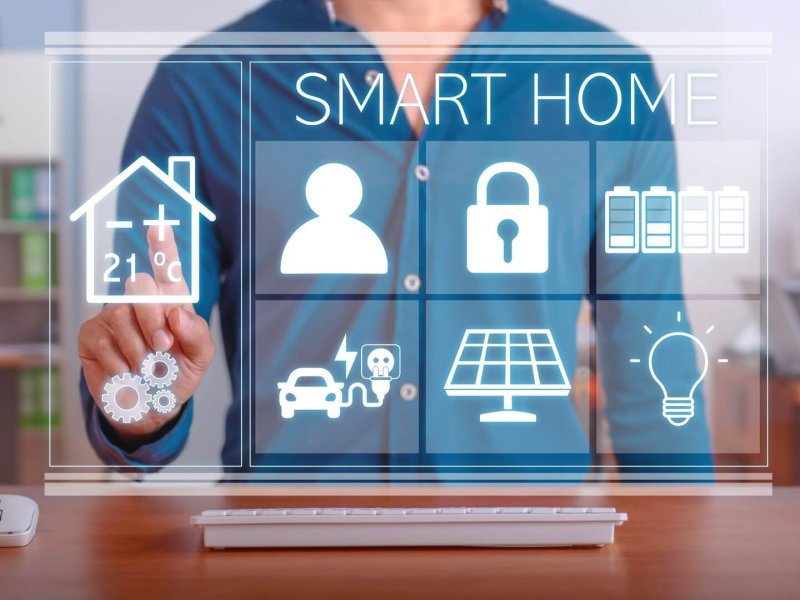 Modern technology for the smart home. Man using the control panel of his smart home.