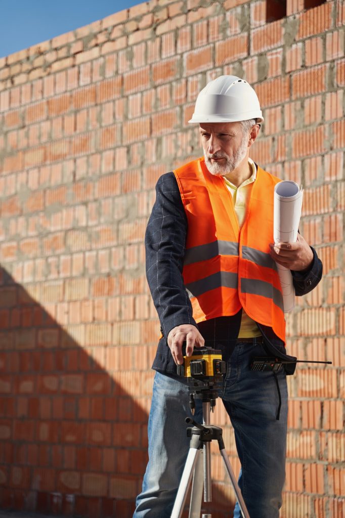 Professional engineer using a laser level in his work