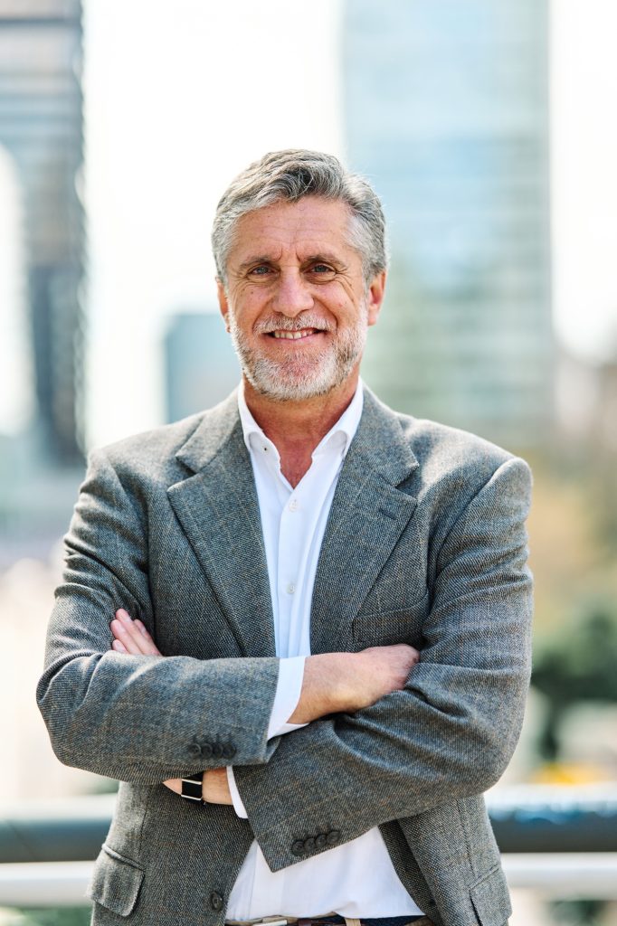 Mature businessman standing proud in a financial district