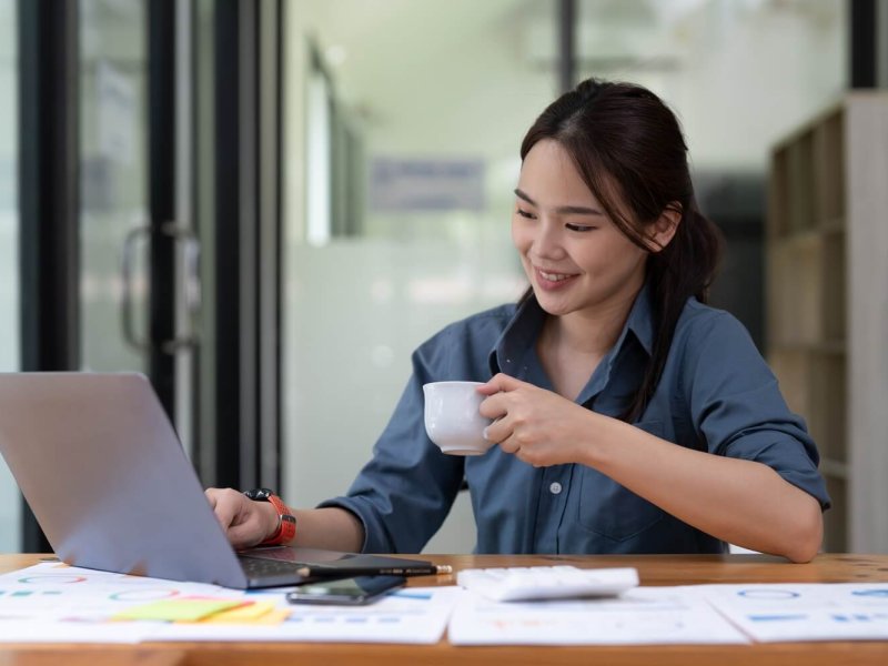 Young woman using laptop while working for business financial investment.