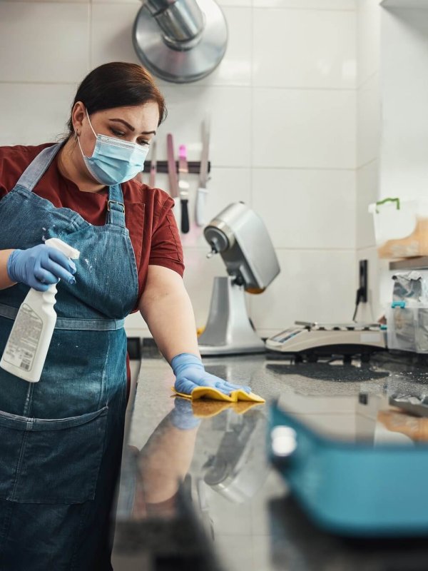 Kitchen personnel responsible for cleaning and sanitizing highly-touched surfaces