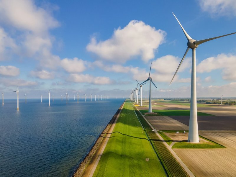 Windmill turbines at sea generate green energy in the Netherlands