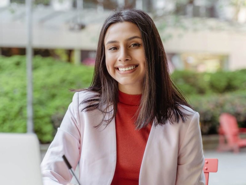 Vertical view happy smart businesswoman studying, learning language