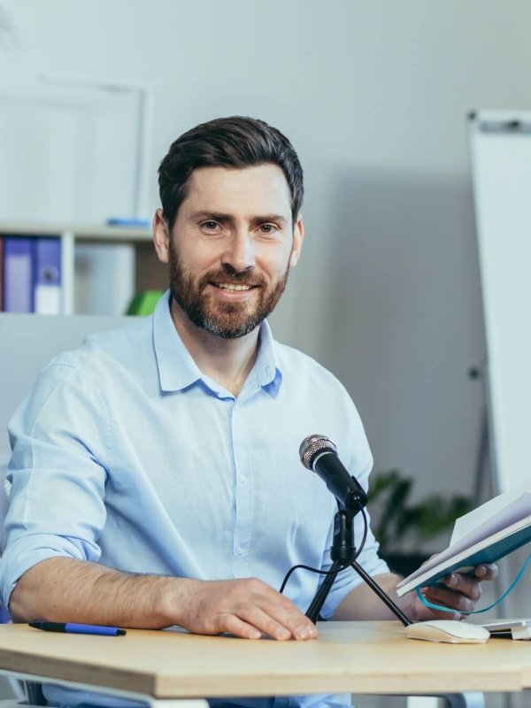 Portrait of a businessman coach, a man looks at the camera and smiles