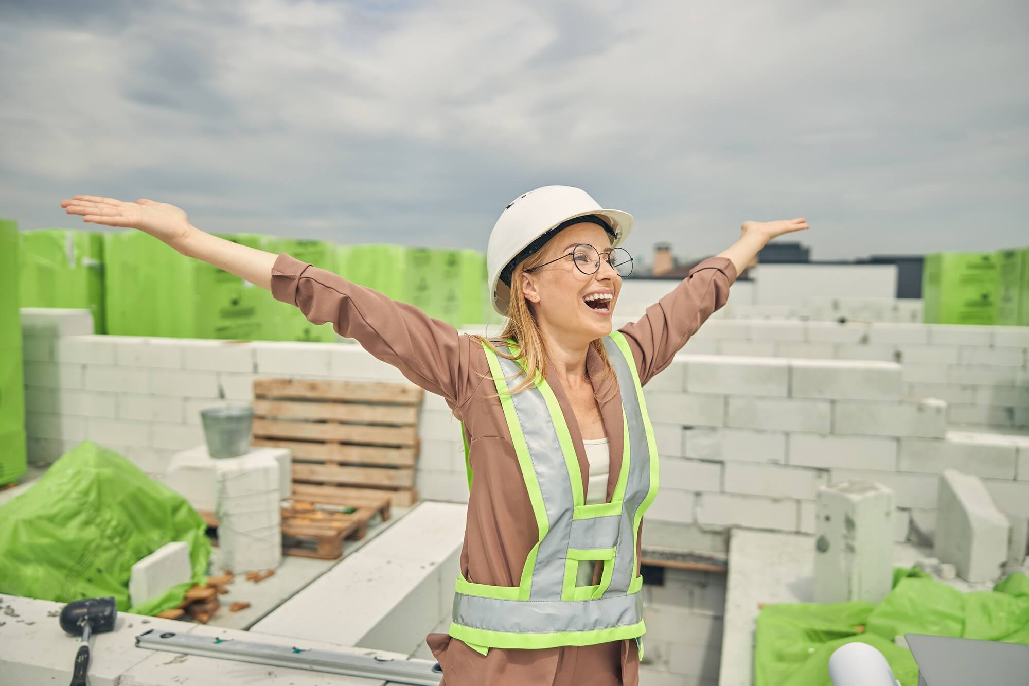 Female contractor admiring a new construction object