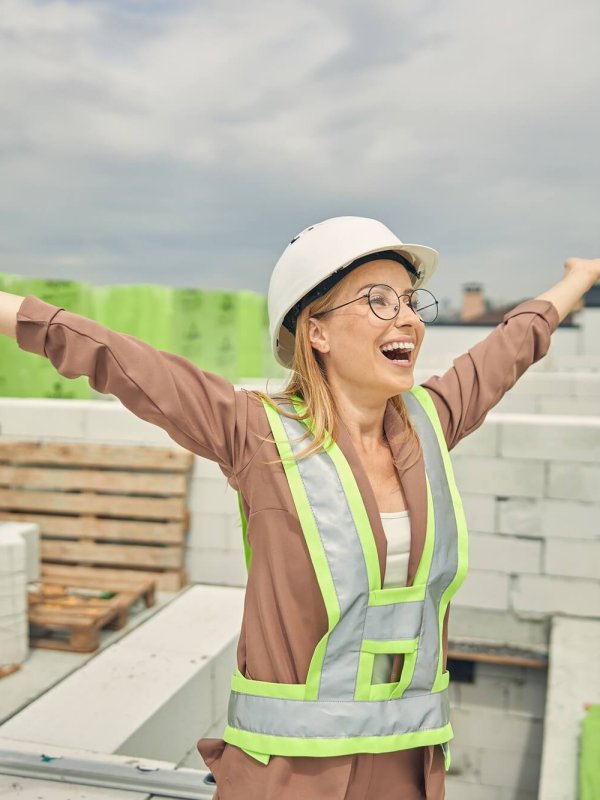Female contractor admiring a new construction object