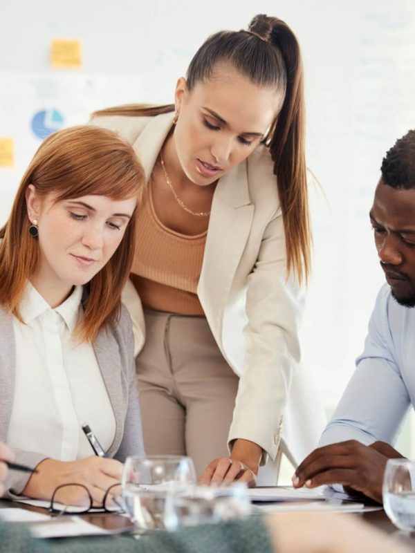 business-people-financial-and-meeting-at-a-table-with-serious-workers-planning-writing-and-prepar