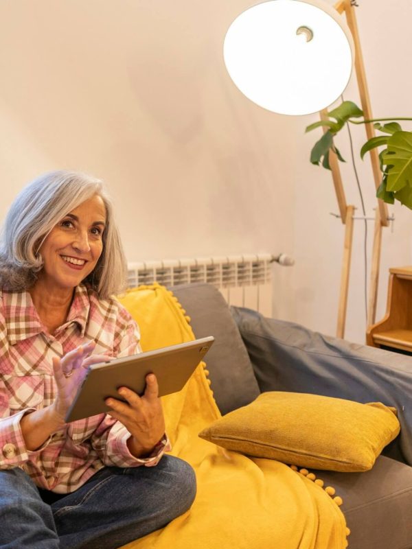 gray-haired-mature-woman-smart-home-home-control-on-tablet-use-smart-home-app
